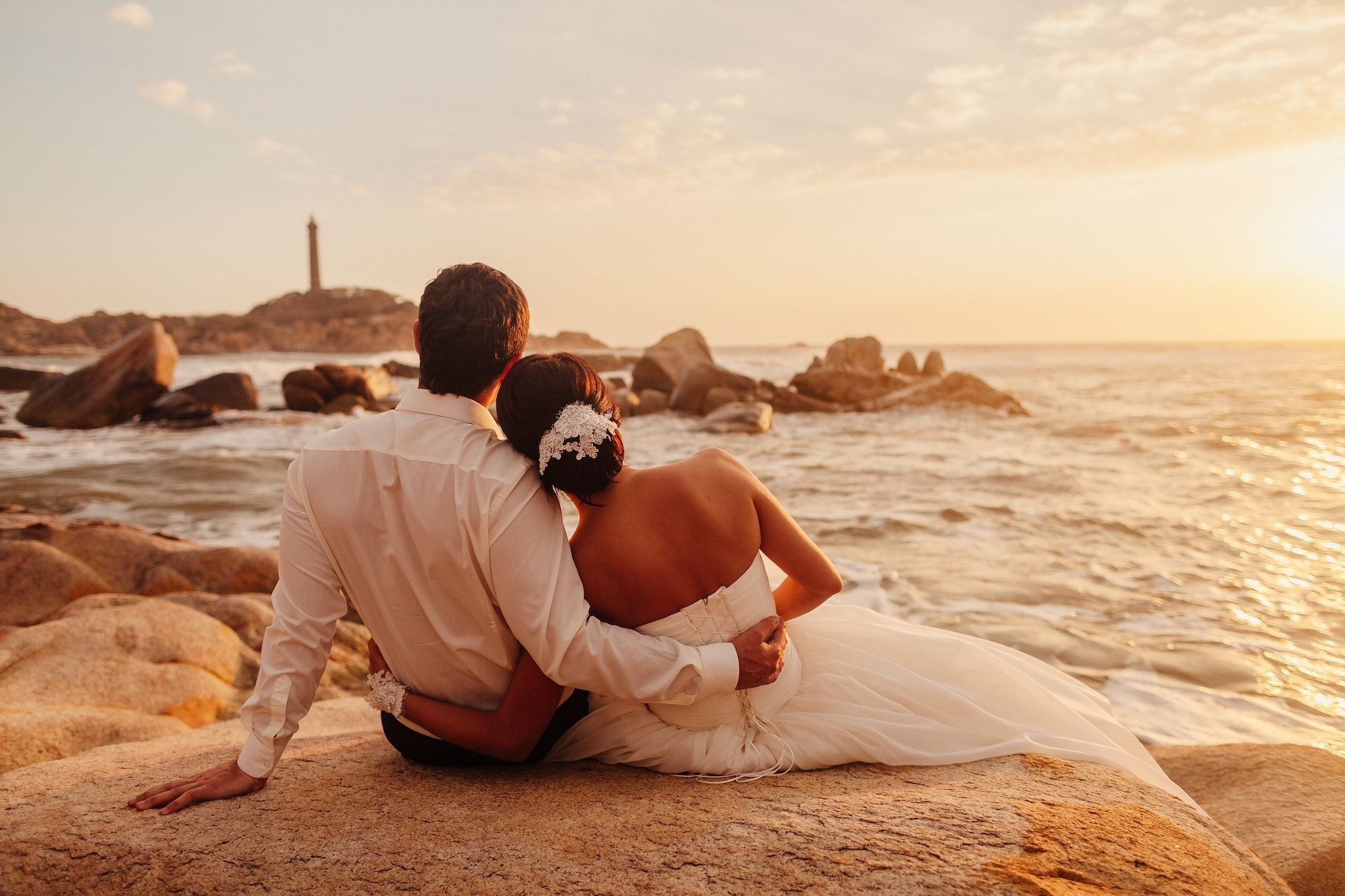 honeymoon couple relax on sunset beach